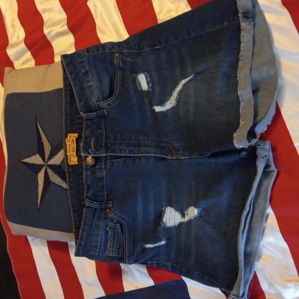Size large wax Jean brand distressed holes in the front cuffed on the bottom gre